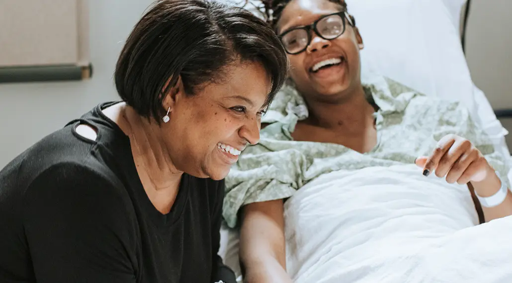 Women in hospital laughing